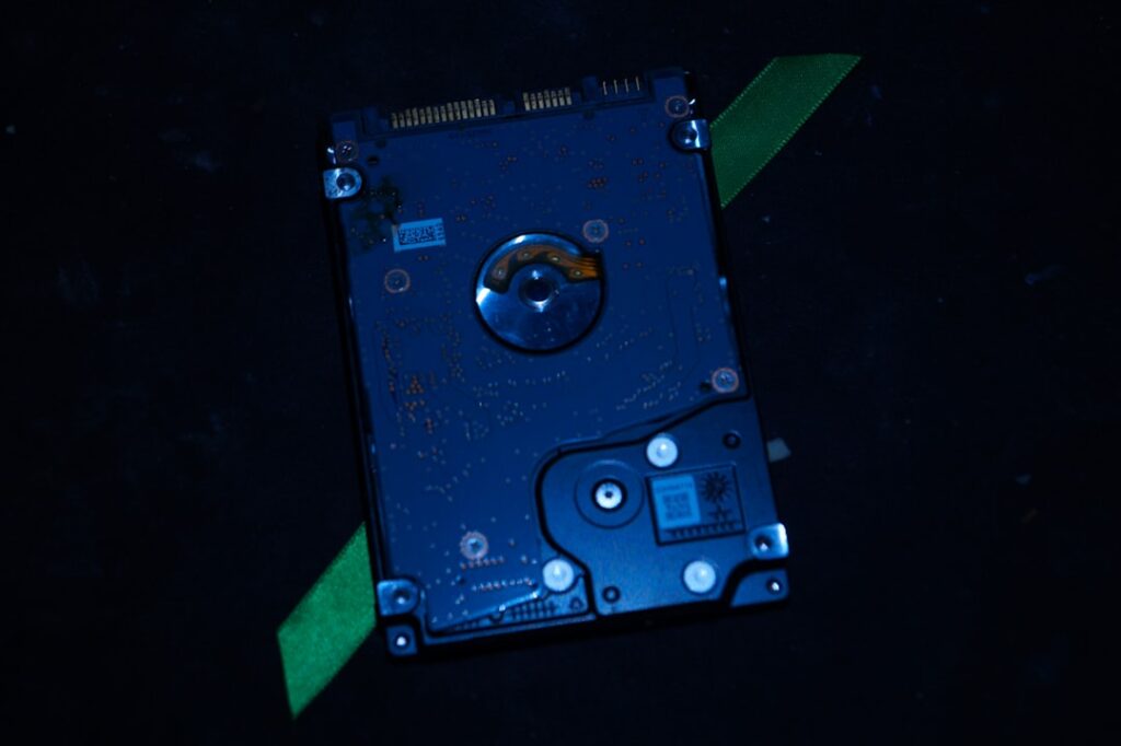 A hard drive sitting on top of a black table