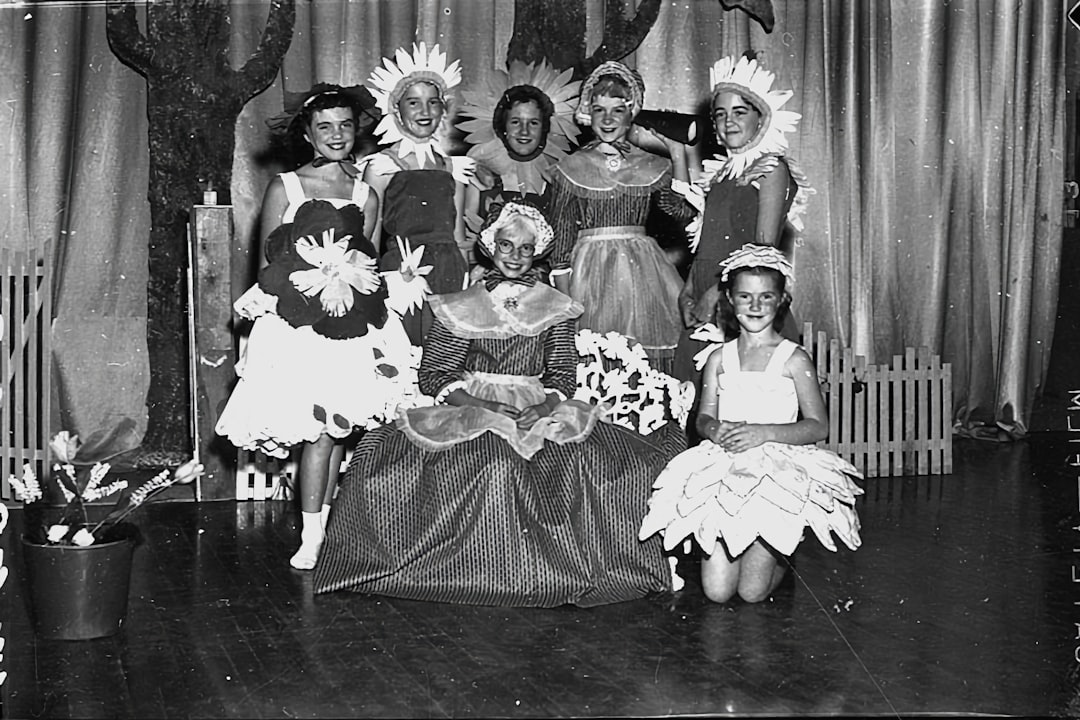 a group of women standing next to each other on a stage