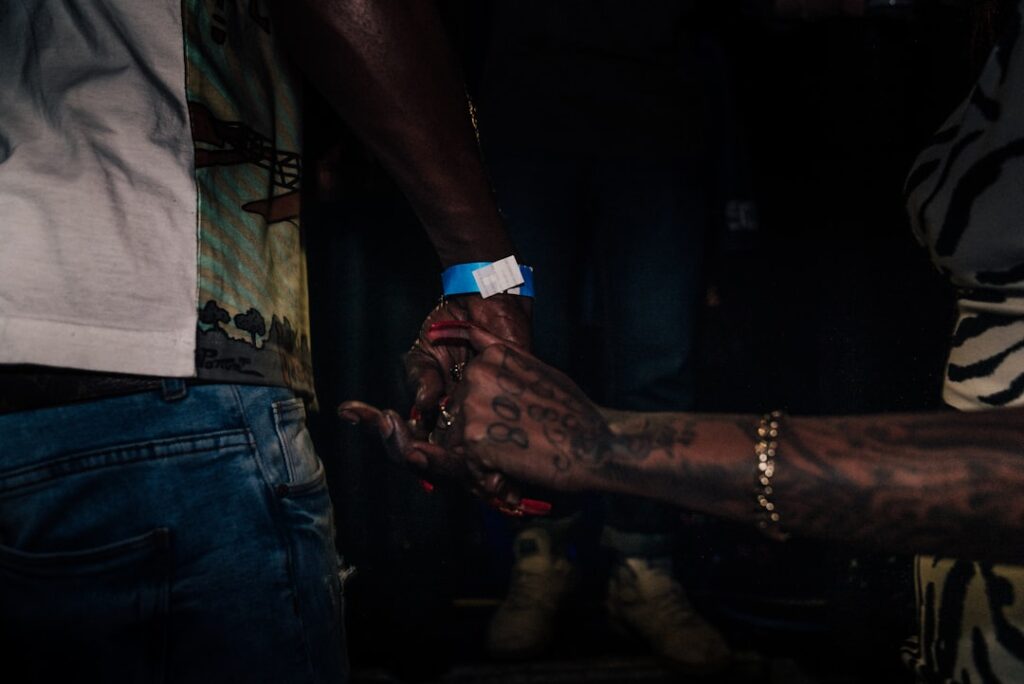 standing person near reaching hand