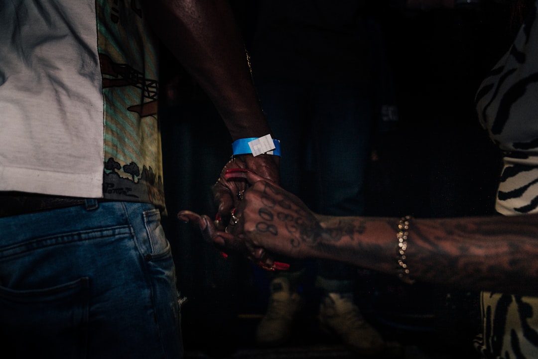 standing person near reaching hand