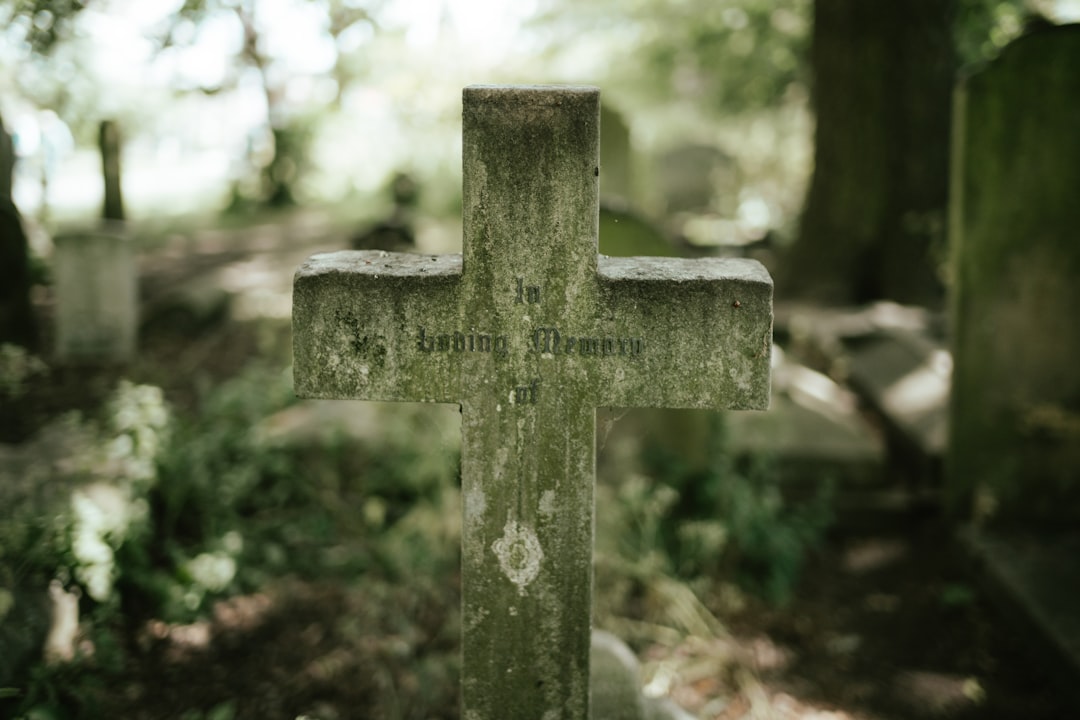 a close up of a cross on a grave
